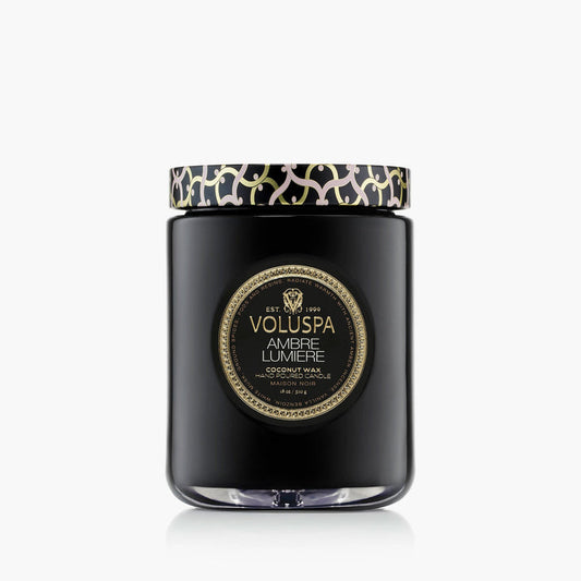 Ambre Lumiere large jar candle with a decorative Maison lattice embossed tin lid, branded by Voluspa, with the scent Ambre Lumiere.
