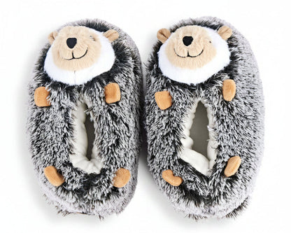 A pair of plush hedgehog slippers in gray and white faux fur with tan accents on the face and paws, shown on a plain white background.