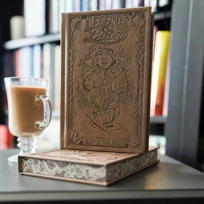 Legends and Lattes Special Edition—tan debossed leatherette cover with characters and chalkboard menu, and matching edges.