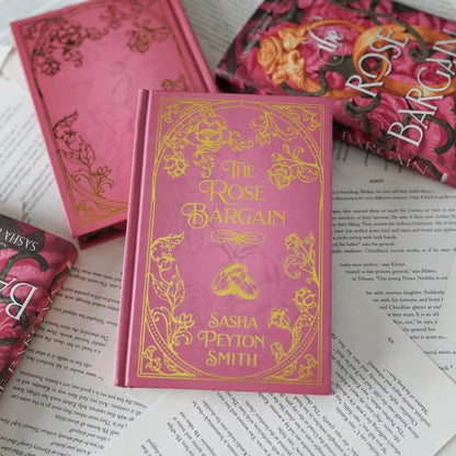 The Rose Bargain LitJoy Edition by Sasha Peyton Smith with new rose-colored casewrap, rose vine edges, and stunning endpapers