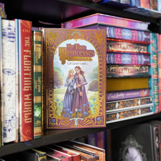 Bookshelf with 'The Two Princesses of Bamarre' by Gail Carson Levine book and other books
