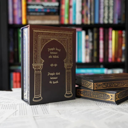 We Hunt the Flame special edition box back cover with gold quote text and arch design beside stacked box sets