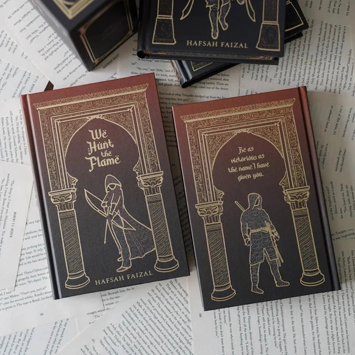 We Hunt the Flame front and back book covers by Hafsah Faizal with gold-foil character illustrations on burgundy hardcover